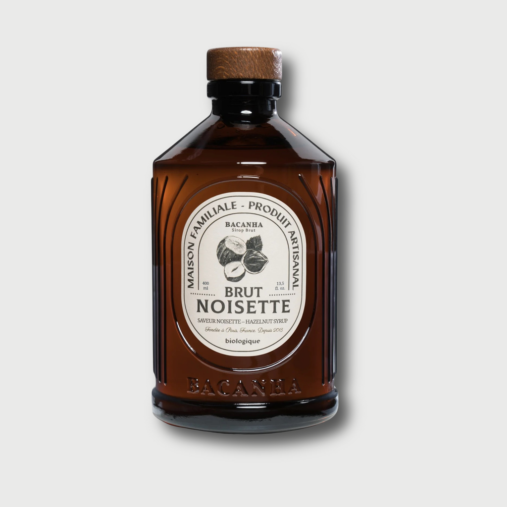 Brown bottle of Brut Noisette on a light gray background