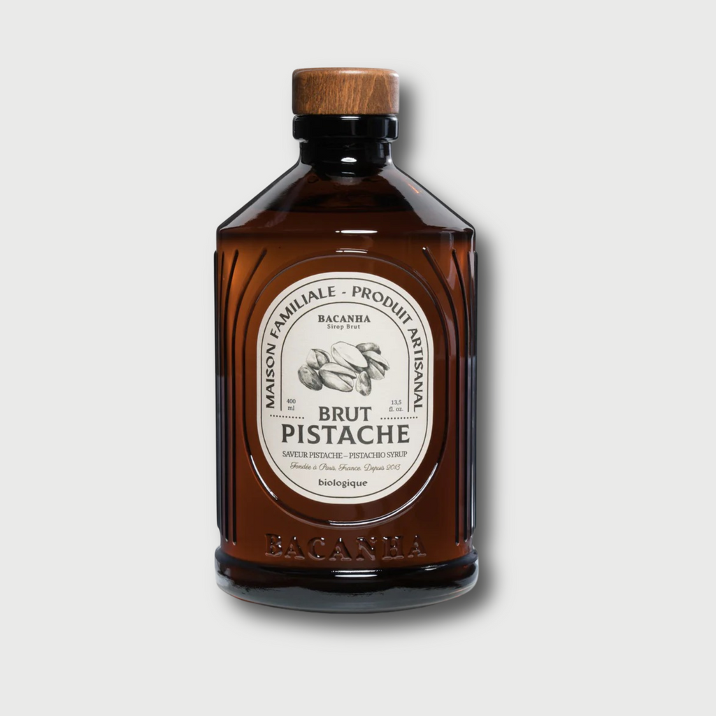 Brown Bacahna Pistache bottle with wooden cap on a white background 