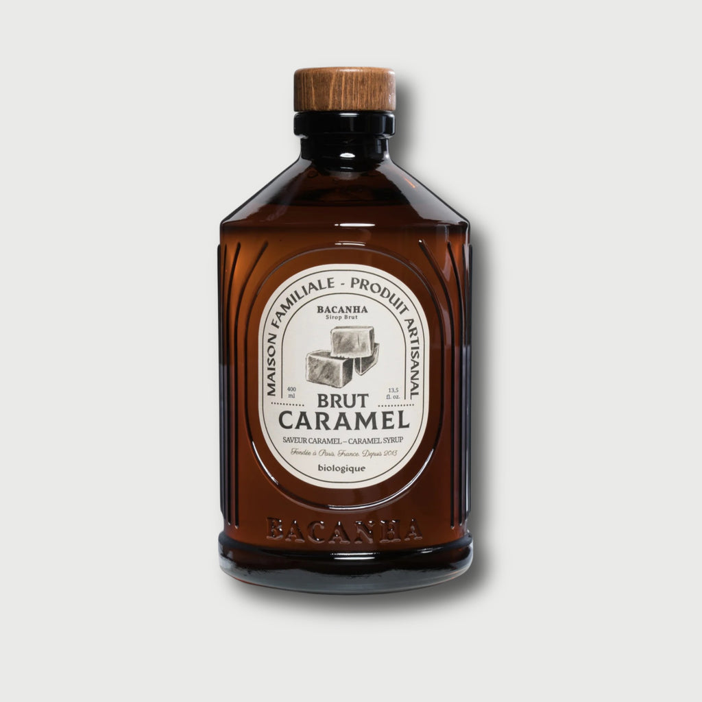 Brown bottle with wooden cap on a light gray background